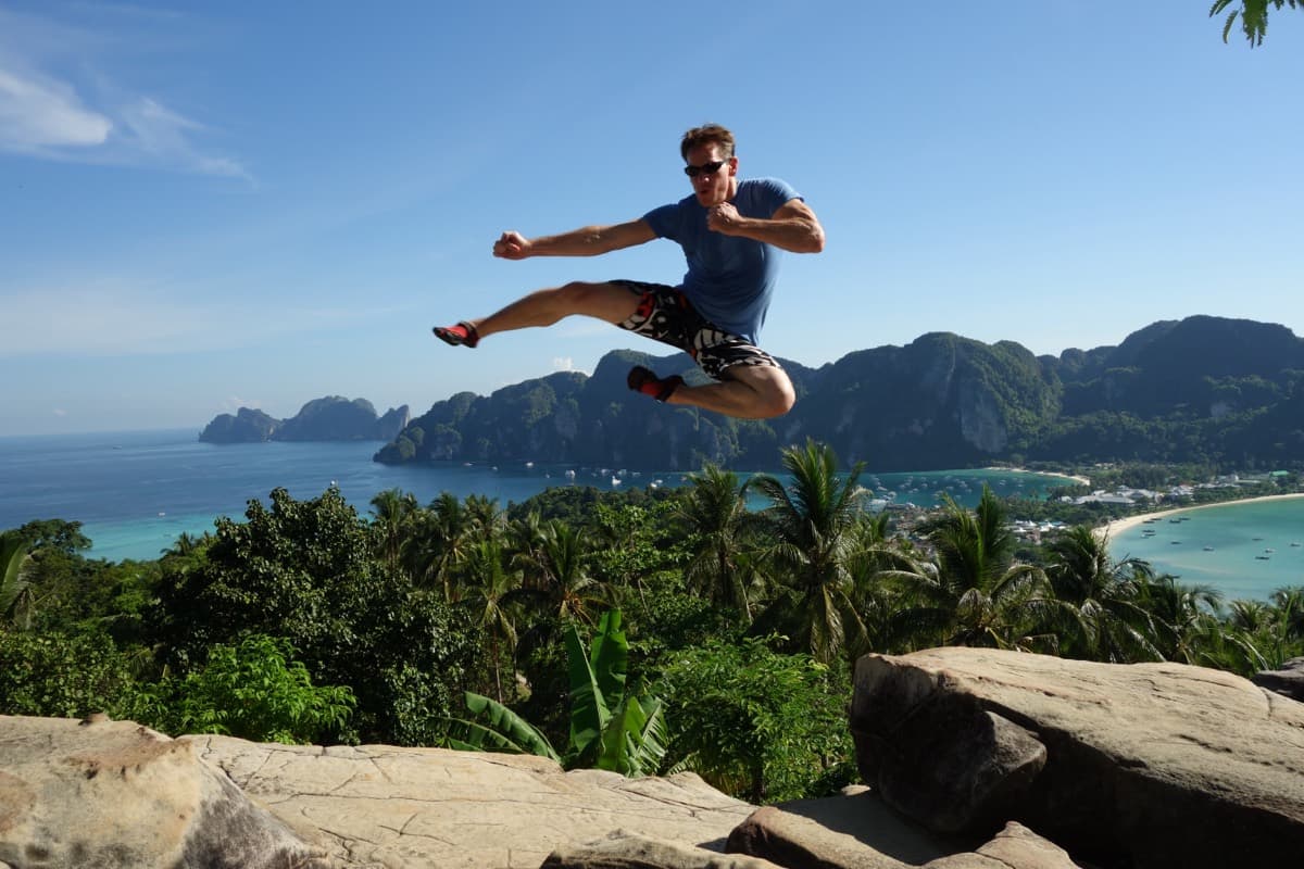 Rick Tew flying kick above Koh Samui